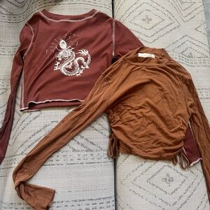 2 small cropped skin tight long sleeve shirts